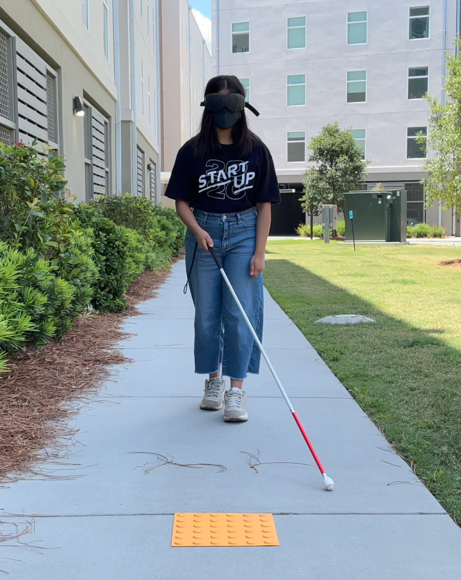 A person using a can with a blind mask on